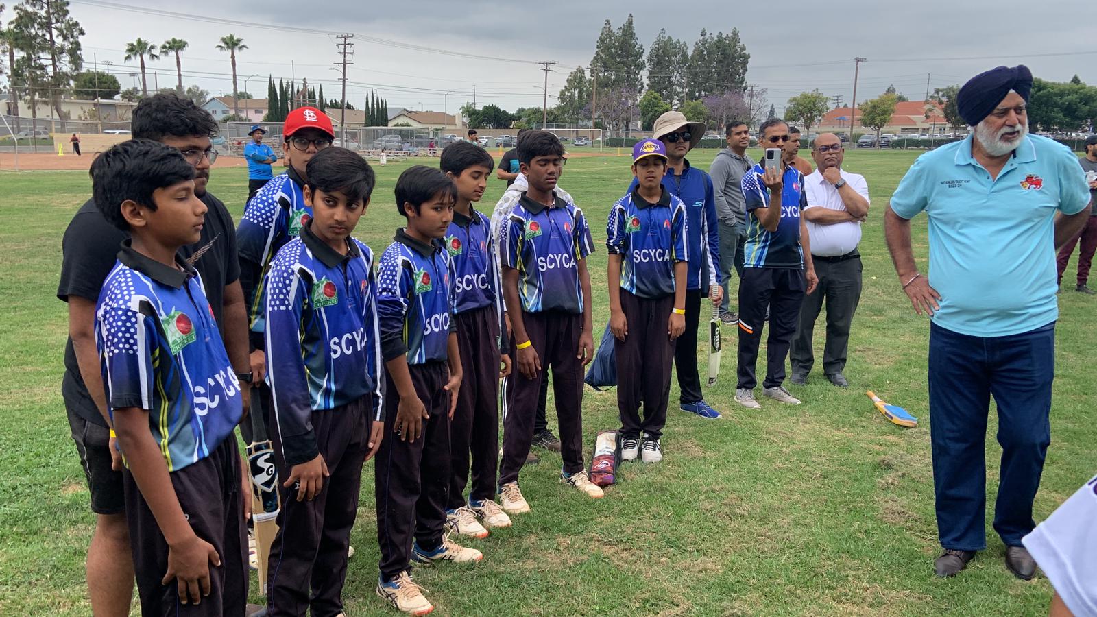 SCYCA youth cricket players in blue on field at Chak de SoCal